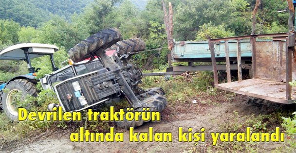 Devrilen traktörün altında kalan kişi yaralandı