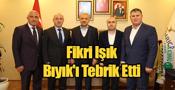 Fikri Işık Bıyık'ı Tebrik Etti