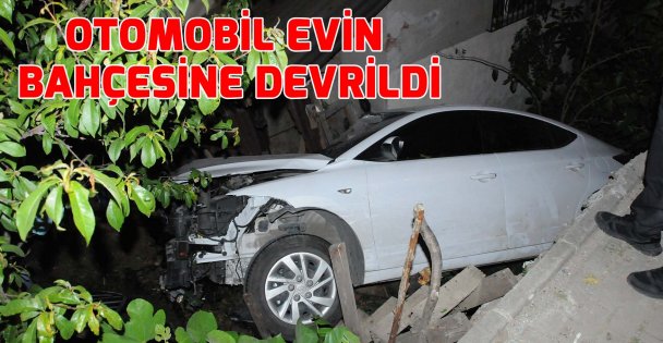 Otomobil evin bahçesine devrildi